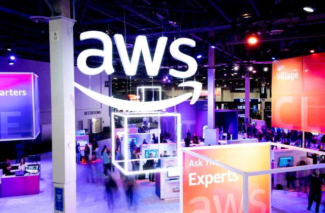 Attendees walk through an expo hall at AWS re:Invent 2022, a conference hosted by Amazon Web Services (AWS), in Las Vegas, Nevada, U.S., November 30, 2022. Noah Berger/AWS/Handout via REUTERS THIS IMAGE HAS BEEN SUPPLIED BY A THIRD PARTY. MANDATORY CREDIT